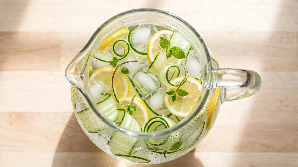 "Glass pitcher of ice water hack recipe with lemon, cucumber, and mint